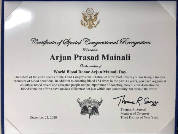 Blood Donor Mainali felicitated by a Member of Congress in the US