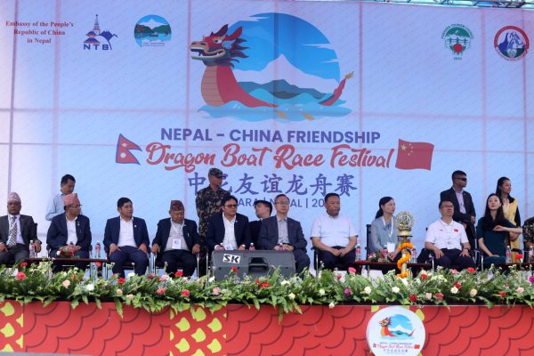 China’s Sichuan Dragon and Nepal’s Nara Dragon teams celebrate victory at Dragon Boat Race Festival